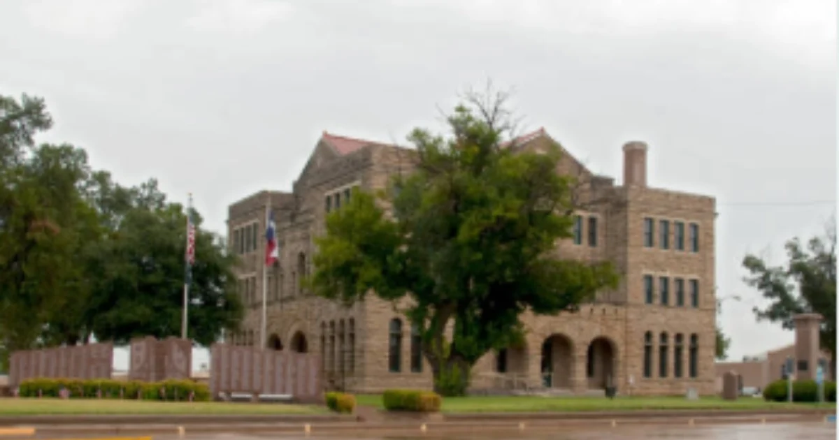 Areas We Serve 6 Historic stone Archer County Courthouse with veterans memorial wall in Archer City Texas