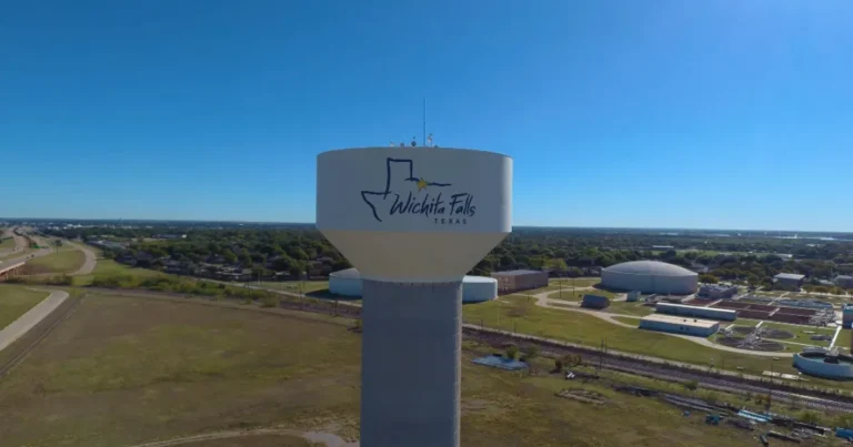 Areas We Serve 3 Aerial view of the branded Wichita Falls, Texas, water tower overlooking the highway and landscape. Dumpster rental near Wichita Falls.